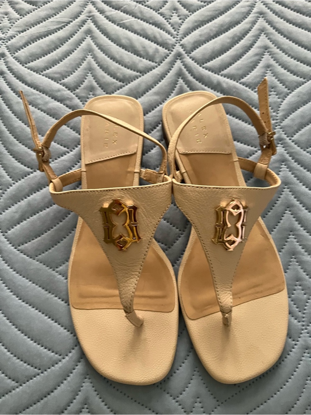 Alex Marie Cream T-Strap Sandals with Gold Monogram